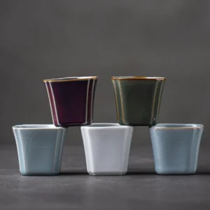 Collection of antique style square gold rimmed porcelain tea cups multiple colors