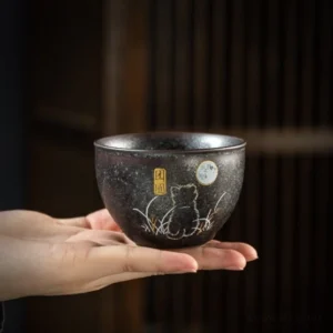 Handmade black ceramic Chinese tea cup with cute animal and lucky characters main view