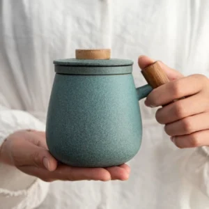 black matte ceramic tea mug with infuser and wood handle full product view