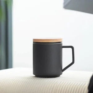 Black matte ceramic tea mug with strainer infuser and natural wooden lid