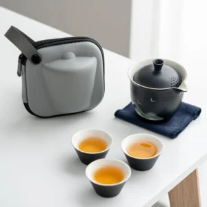 Portable black ceramic travel chawan set with hard case, full unboxed view