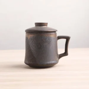 full view black gold handcrafted ceramic tea infuser mug with lid and infuser