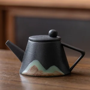 Black porcelain teapot with hand painted Japanese mountain landscape, matte finish