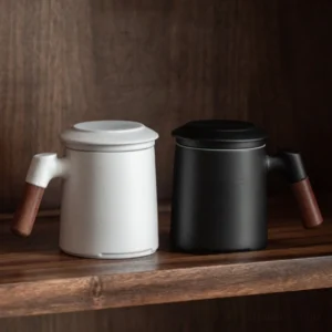 Whole set of black and white ceramic tea infuser mug with infuser, lid and wood handle