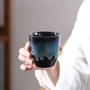 Handcrafted blue gradient Jianzhan porcelain tea cup with gold rim