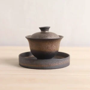Full bronze metallic porcelain gaiwan tea set with teacups, deep charcoal with bronze shimmer texture