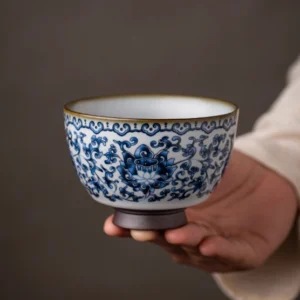 Traditional Chinese blue and white porcelain tea cup with interlocking lotus pattern