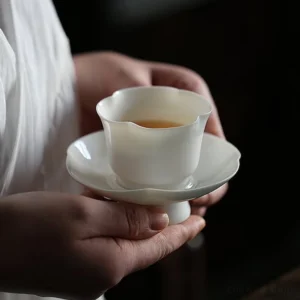 Chinese pure white porcelain petal edge tea cup and saucer set full view