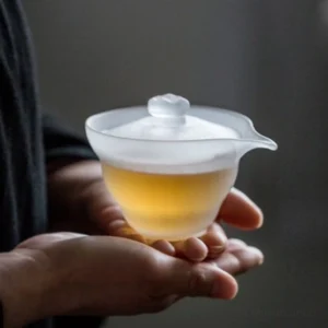 Handcrafted frosted glass gaiwan 5oz on wooden surface, minimalist modern Chinese tea ware