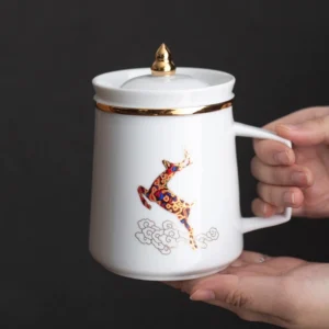 Full product view of white ceramic 13.5oz tea infuser mug with gold accents