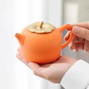 full set of handcrafted persimmon shaped porcelain tea set including teapot two cups and tea tray
