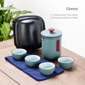 Green portable ceramic chawan travel tea set with carrying case open showing teapot and four teacups