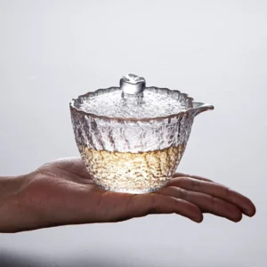 Hammered textured clear glass 5oz gaiwan for tea brewing held in hand