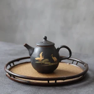 Full side view of hand-gilded dark gray porcelain crane teapot 8oz