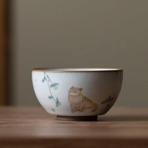 multiple styles of hand painted cat chinese ceramic tea bowls arranged together