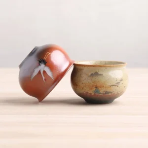 Hand painted Chinese ceramic tea cup collection with crane and landscape motifs