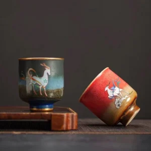 Hand painted auspicious deer motif porcelain tea cup with gold trim