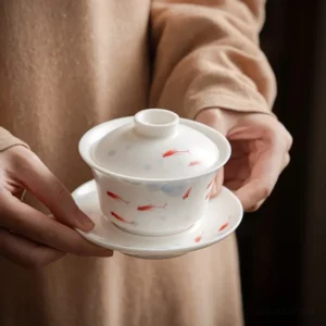 Hand-painted fish motif porcelain gaiwan 5oz on white background