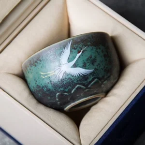 side view of hand painted lotus crane chinese ceramic tea bowl