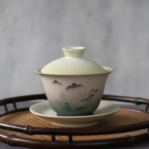 Hand-painted porcelain gaiwan with Chinese mountain landscape gradient green glaze