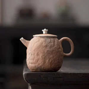 handcrafted 7.4oz rock texture coarse clay teapot with 999 silver accent full view