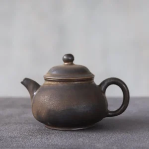 Full view of handcrafted rustic 3.4oz small porcelain teapot
