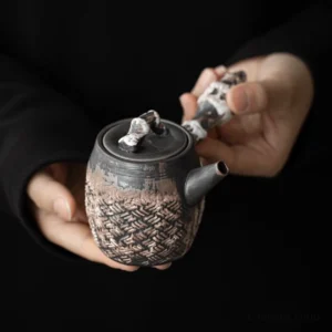 Handcrafted textured side handle porcelain teapot main product view