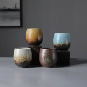Collection of four handcrafted speckled gradient Chinese ceramic tea cups different styles
