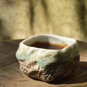 Handcrafted wabi-sabi Chinese tea bowl with natural rock texture, 3.4oz capacity