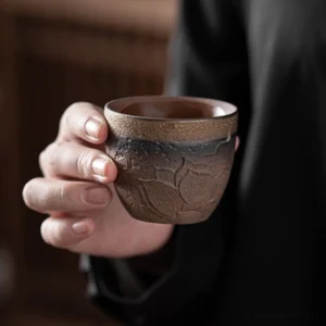 Handmade embossed lotus Chinese zisha tea bowl side view