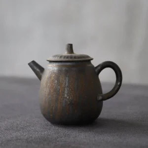 full side view of 6oz handcrafted iron rust glaze porcelain teapot