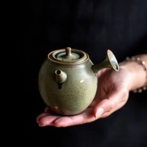 Japanese style side handle porcelain teapot muted green glaze with golden ginkgo