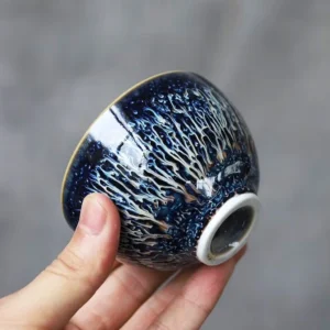 Collection of handcrafted Jianzhan starry sky tea cups with unique celestial kiln change glaze