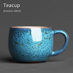Handmade Chinese Jun Kiln blue green porcelain tea cup with golden speckles front view