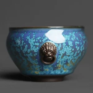 Handcrafted Chinese Jun Kiln blue glaze tea bowl with lion-head decoration side view