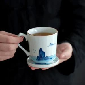 Set of three modern Chinese porcelain tea cups with mountain fish wave designs