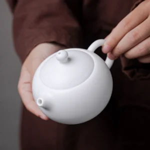 Mutton fat jade porcelain Xishi teapot 7oz, handheld full view