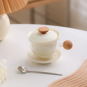 Pink glass tea infuser mug with ceramic filter, lid and saucer product view