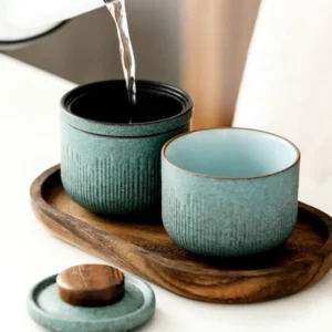Portable 4oz ceramic chawan travel tea set with wood handle displayed with carrying case