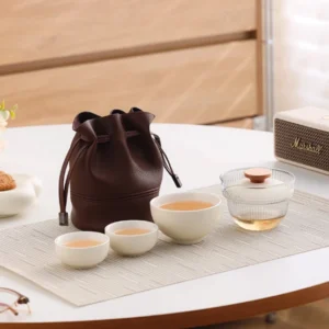 Portable beige travel chawan set with glass gaiwan 3 ceramic cups and brown travel bag