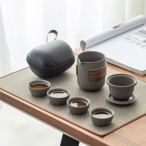 Full set of portable ceramic chawan travel tea set with black waterproof carrying case open