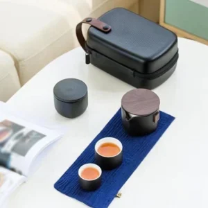 Complete portable ceramic travel tea set with storage case and blue brewing mat