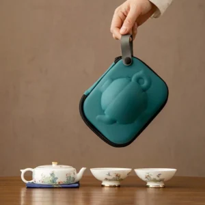 Complete portable porcelain chawan travel tea set with protective deep green carrying case