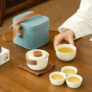 Full set of creamy white porcelain portable travel chawan tea set with blue carrying case