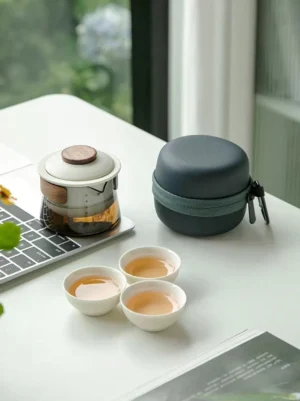 full opened portable glass kung fu travel chawan tea set with teapot and teacups arranged outside carrying case