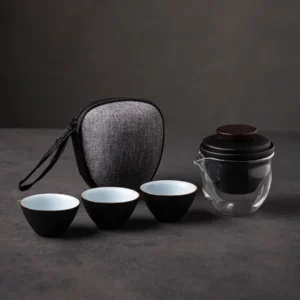 Complete portable travel chawan tea set with glass teapot, three ceramic teacups, carrying bag and tea towel