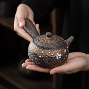Rustic ceramic side handle teapot with built-in infuser plum blossom decor full view 11oz