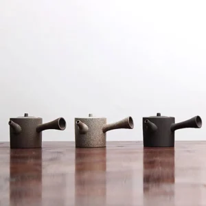 side profile of rustic rough clay side handle porcelain teapot 6oz