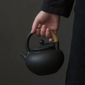 17oz traditional Japanese volcanic stone clay black teapot full view with hemp rope handle
