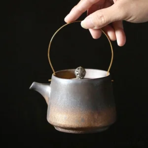 full view of vintage handcrafted 7oz porcelain teapot with gold metal handle